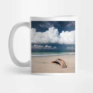 Beach driftwood and dark blue sky Mug